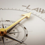 Compass rose pointing to the word LAW